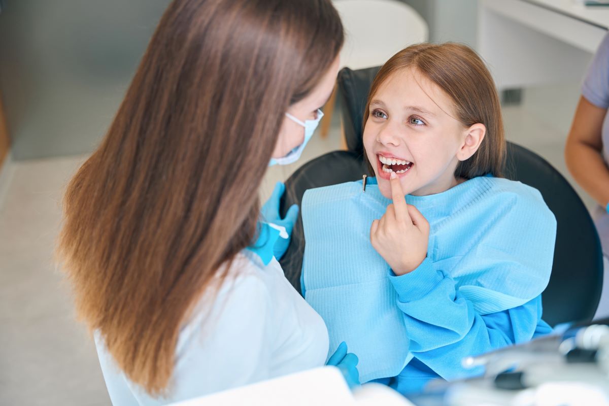 Girl Smiling After Dental Emergency Is Resolved
